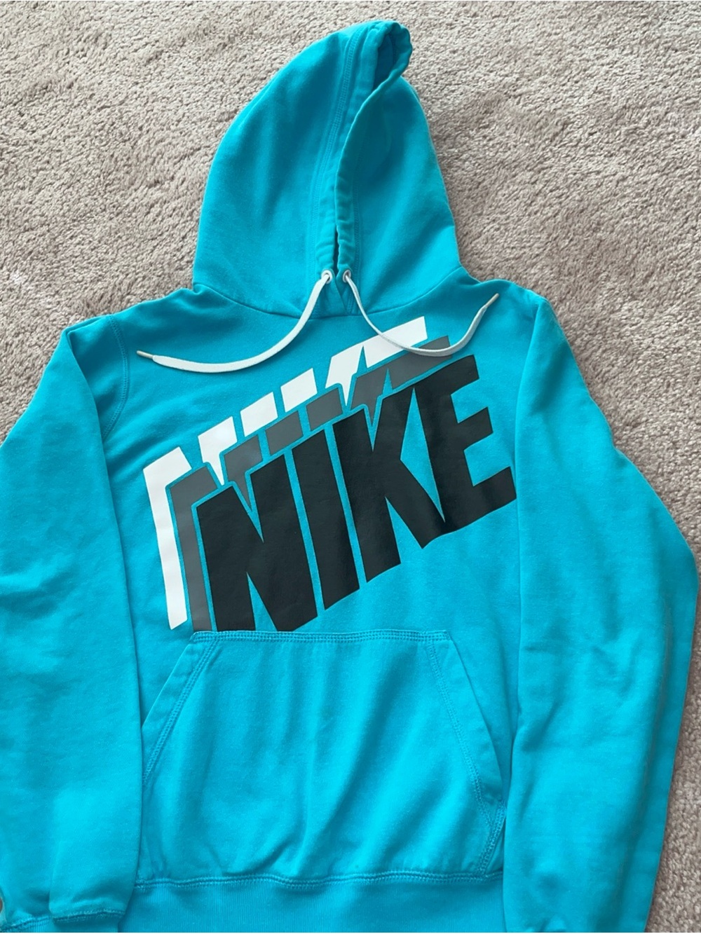 Kids teal blue Nike hoodie size medium.